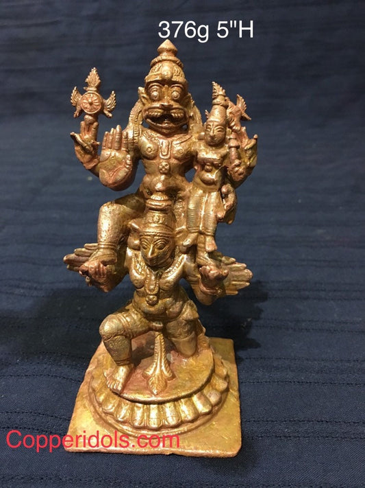 Copper idol of Garuda carrying Lakshmi Narsimha