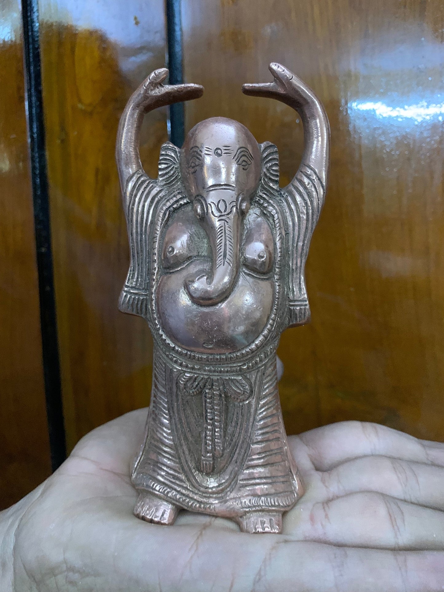 Indian antique store presents vintage idol of standing ganesha