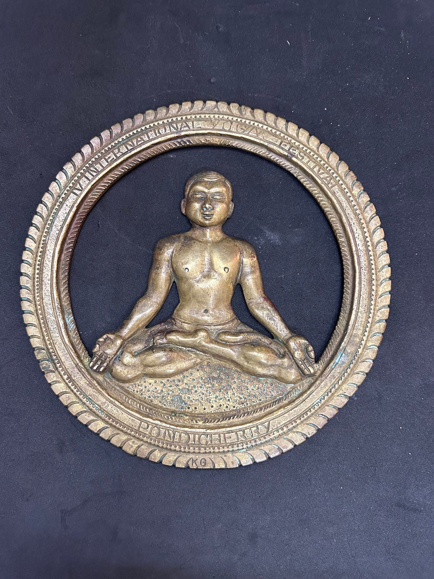 Vintage bronze cast Yoga performing man in a circle souvenir