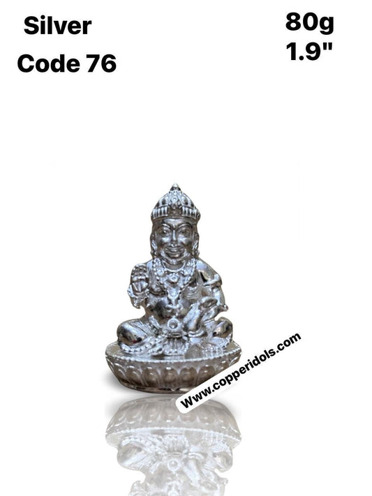 silver made kubera idol