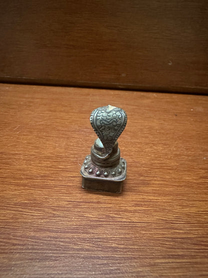 Vintage silver cast naga peeta with pearl linga inside