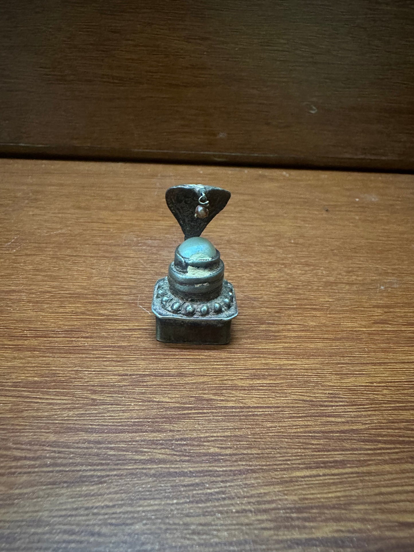 Vintage silver cast naga peeta with pearl linga inside