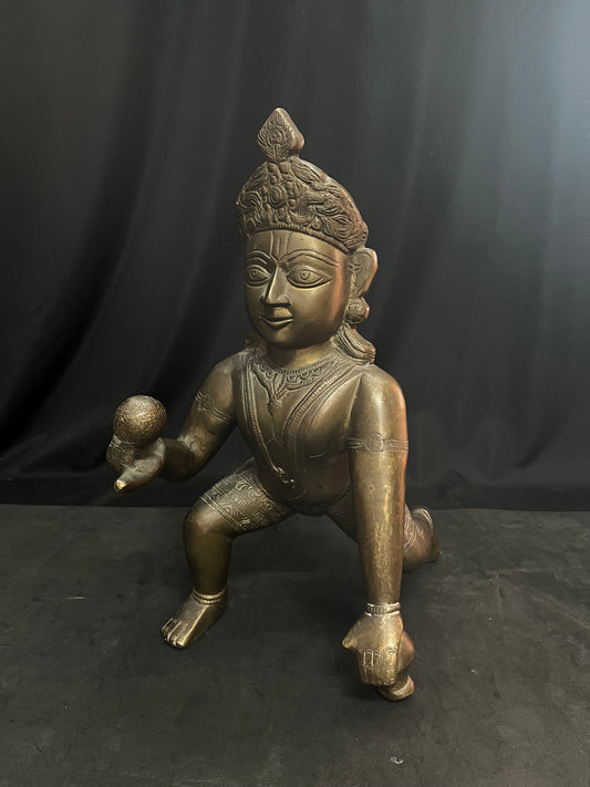 Vintage brass cast Crawling Krishna from deccan