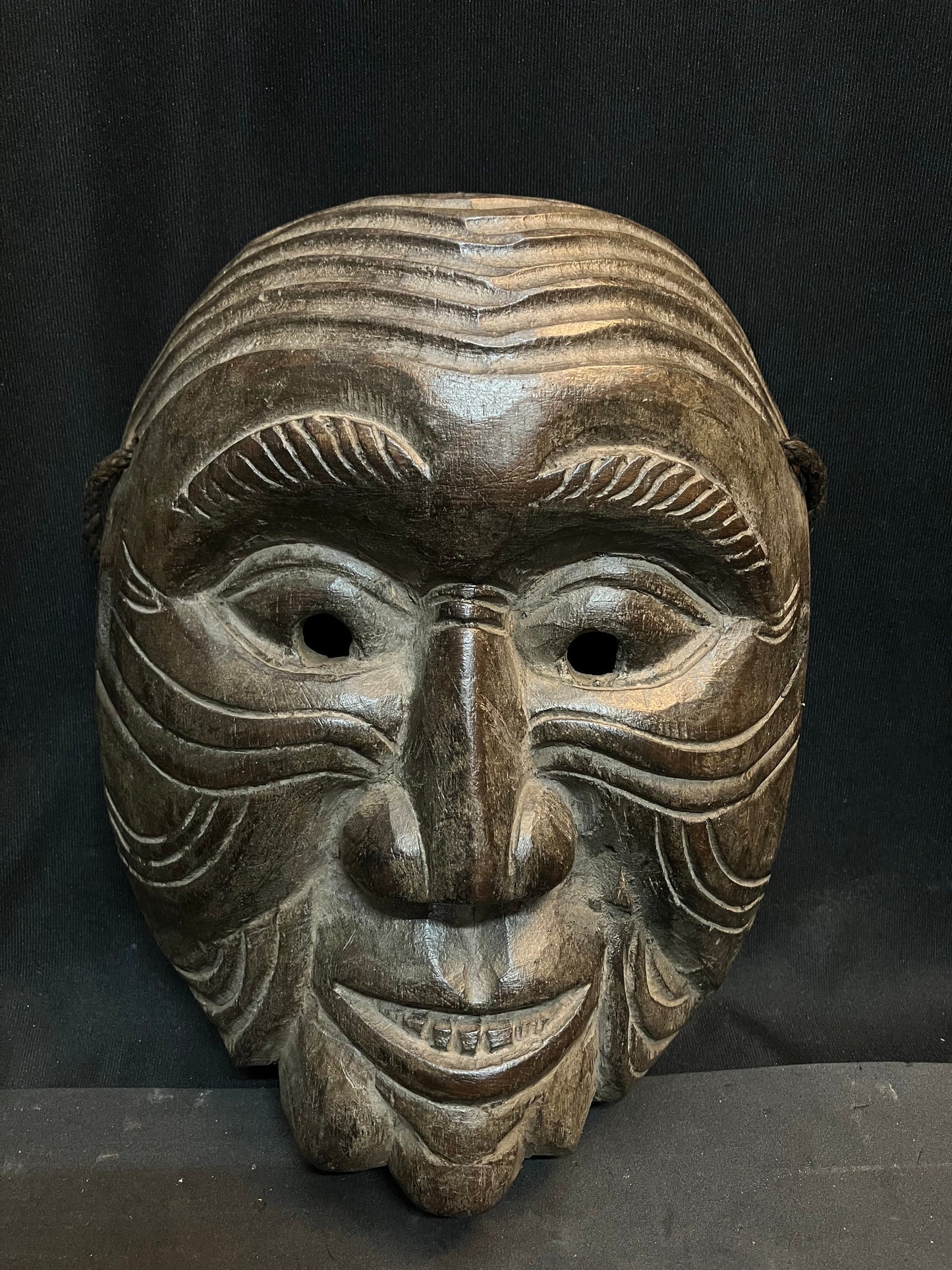 Vintage wooden mask made using single wood