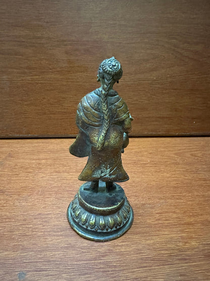 vintage bronze cast lady with surai , a wine jug serving lady