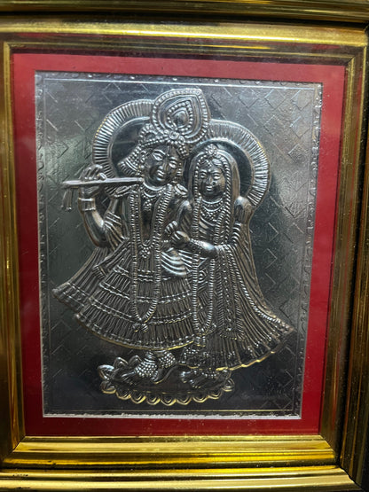 Silver sheet embossed radha krishna in a frame