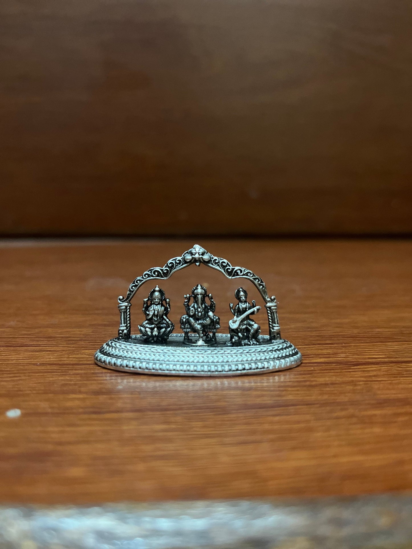 silver casted idol of lord ganesha lakshmi saraswati