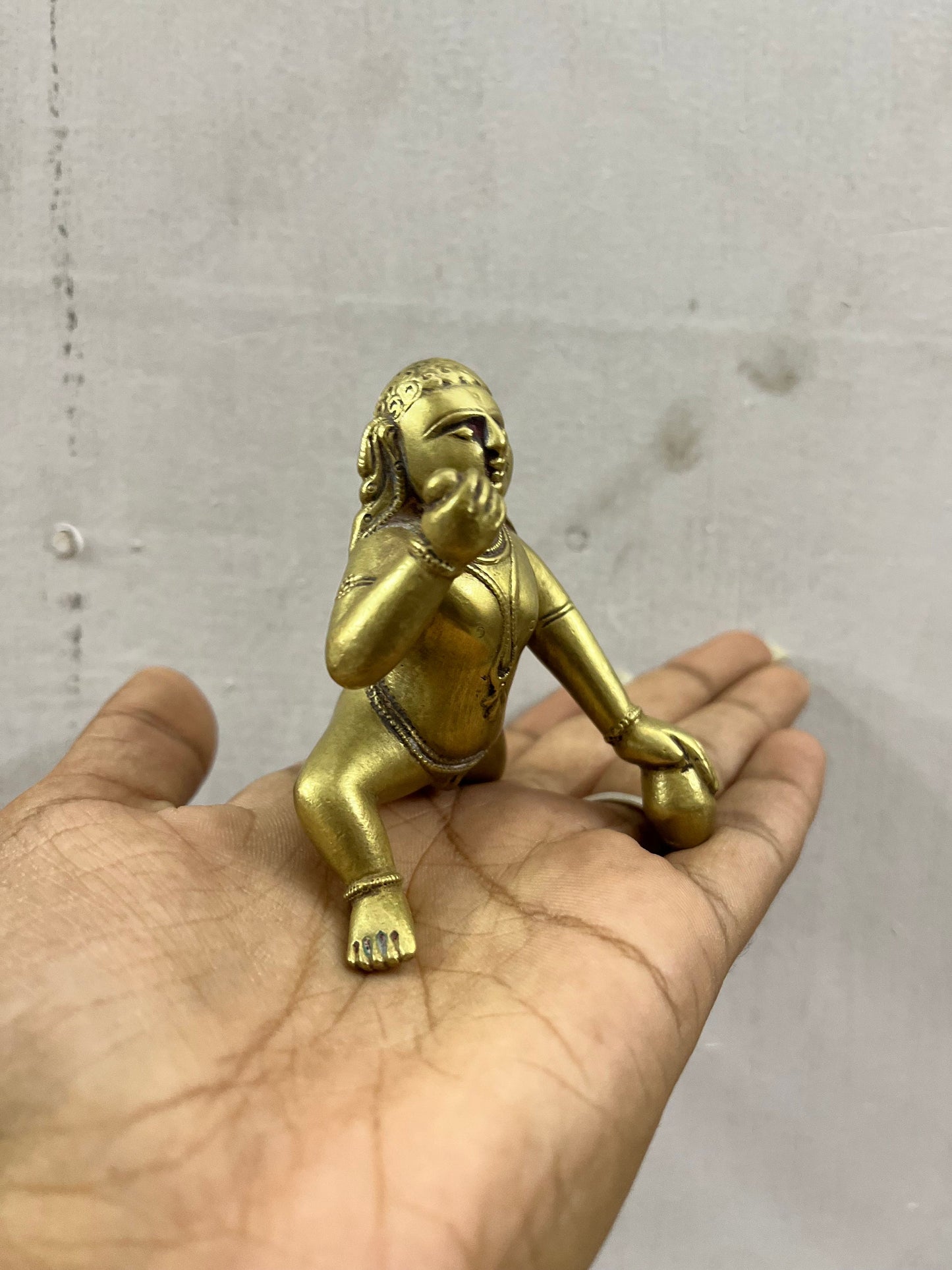 Vintage deccan cast crawling krishna in brass