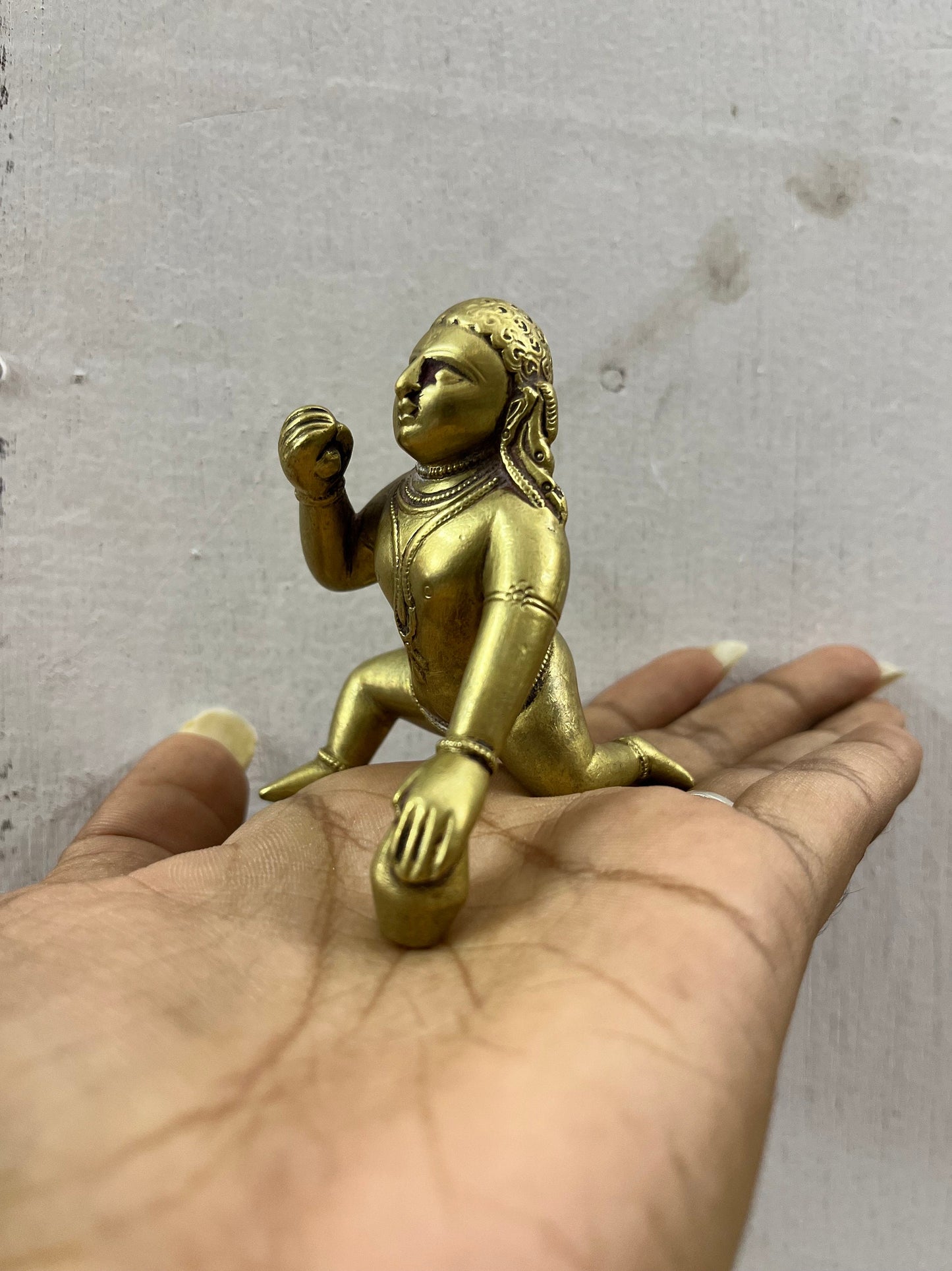 Vintage deccan cast crawling krishna in brass