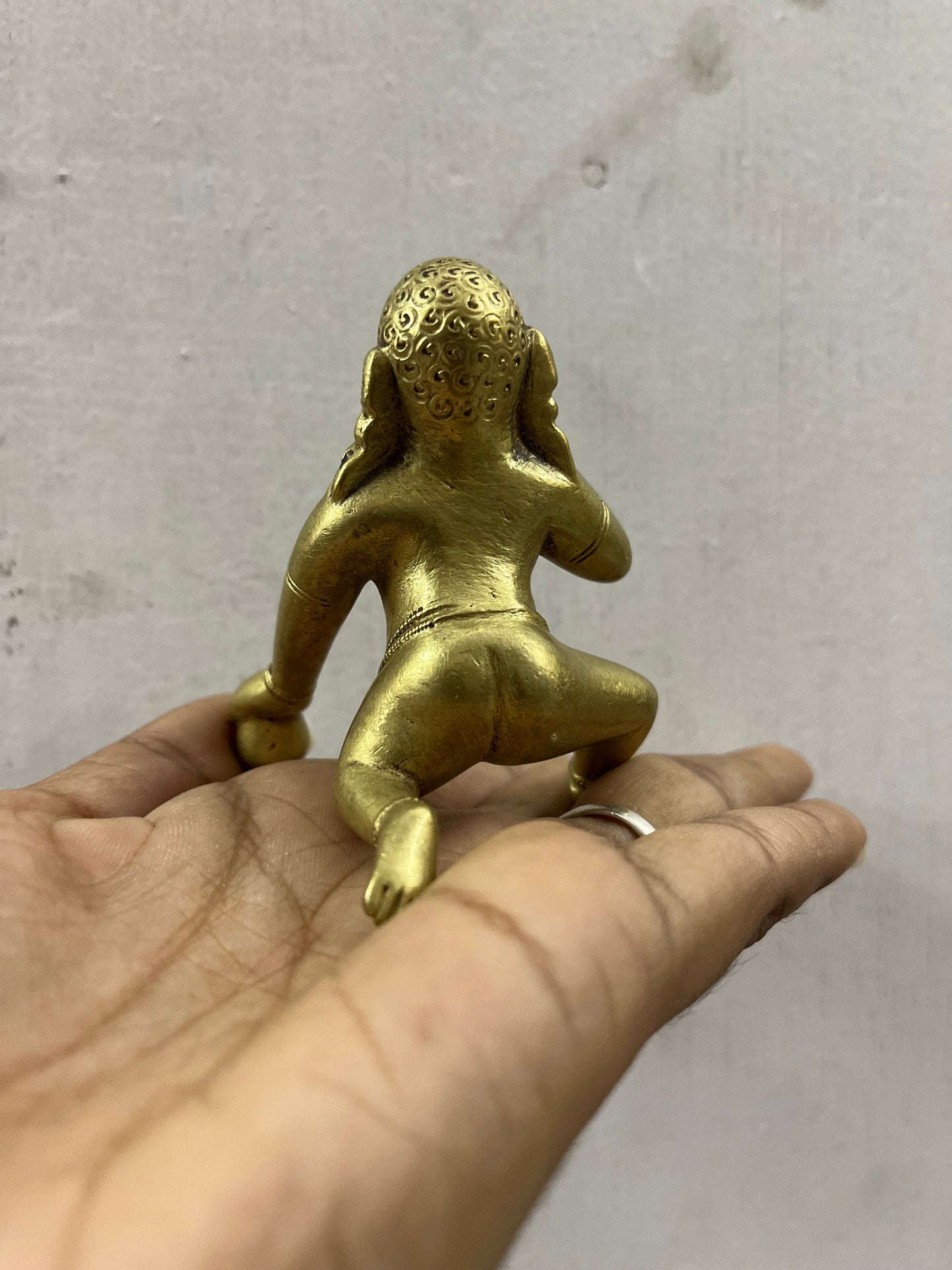 Vintage deccan cast crawling krishna in brass