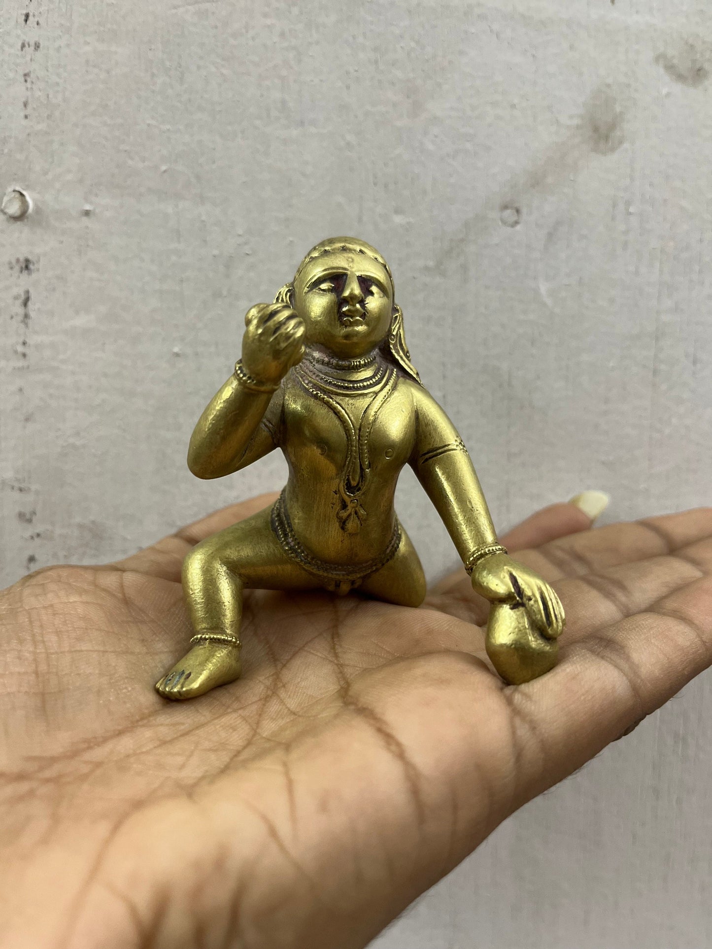 Vintage deccan cast crawling krishna in brass