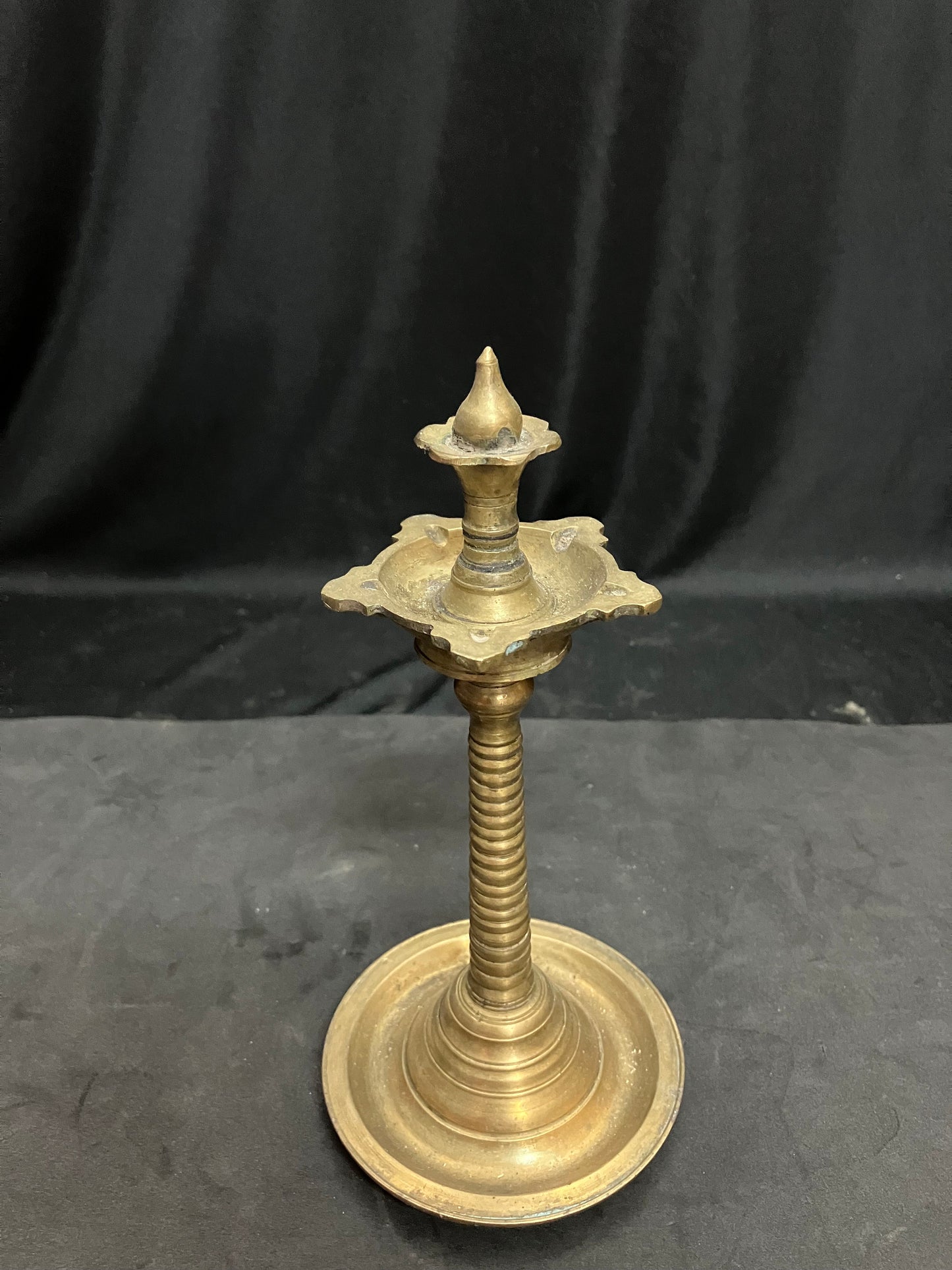 vintage bronze cast unique shaped oil lamp with flower bud atop