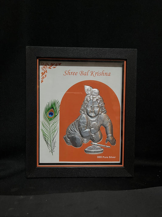 silver embossed krishna in a frame