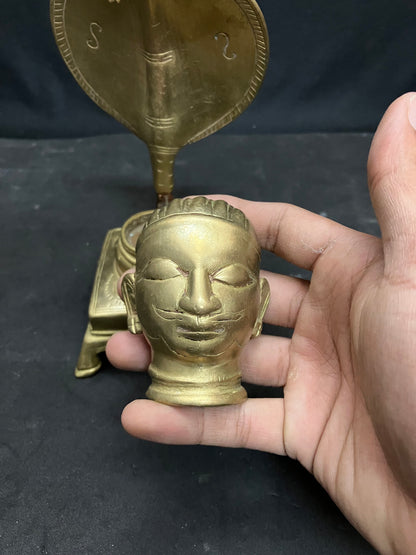 Vintage bronze cast Mukha lingam on a Naaga nandi peeta