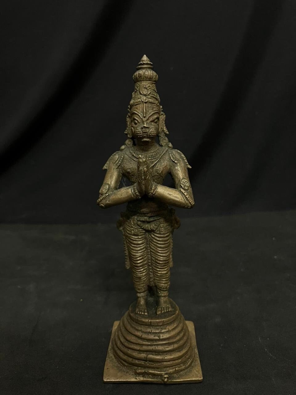 Indian antique store presents vintage idol of hanuman standing on the his tail