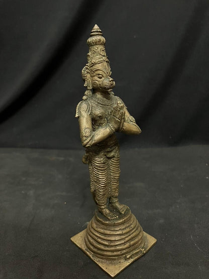 Indian antique store presents vintage idol of hanuman standing on the his tail