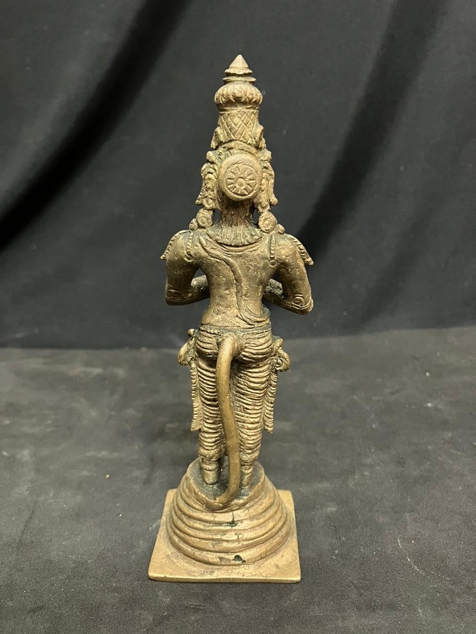 Indian antique store presents vintage idol of hanuman standing on the his tail