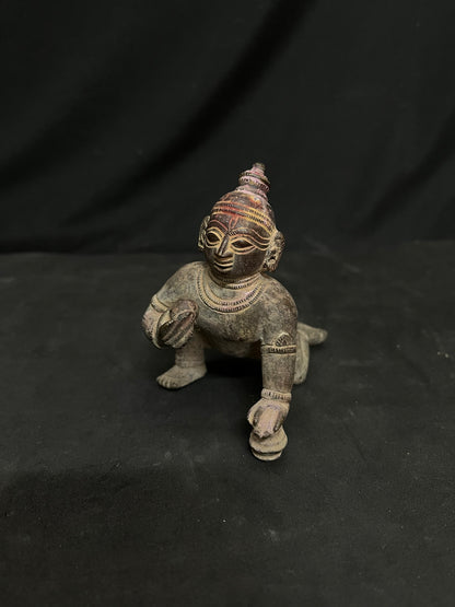 Indian antique store presents vintage idol of bala krishna from odisha