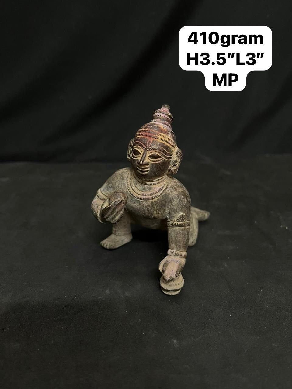 Indian antique store presents vintage idol of bala krishna from odisha