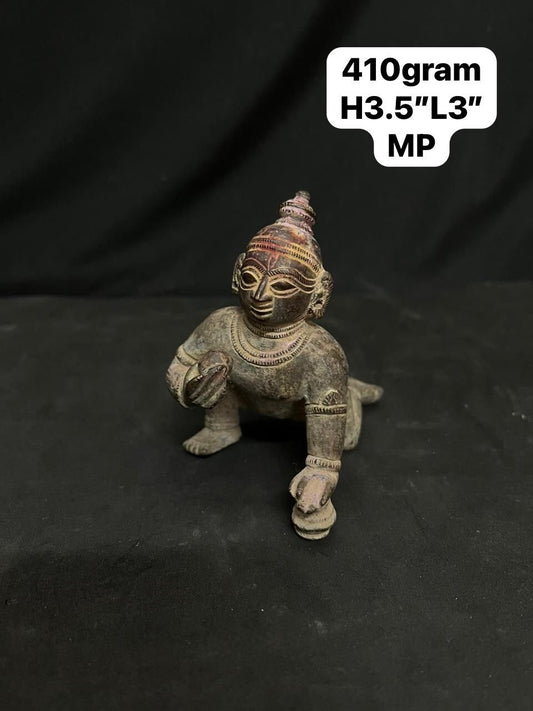 Indian antique store presents vintage idol of bala krishna from odisha