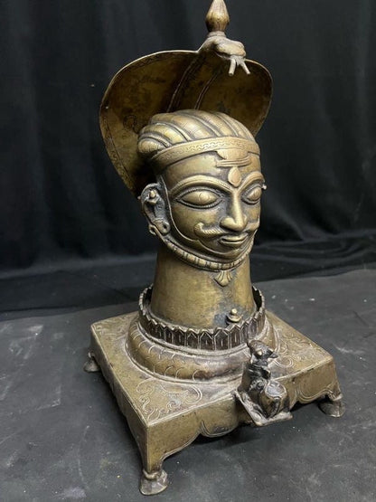 Vintage bronze cast Mukha lingam on a naag nandi peetam