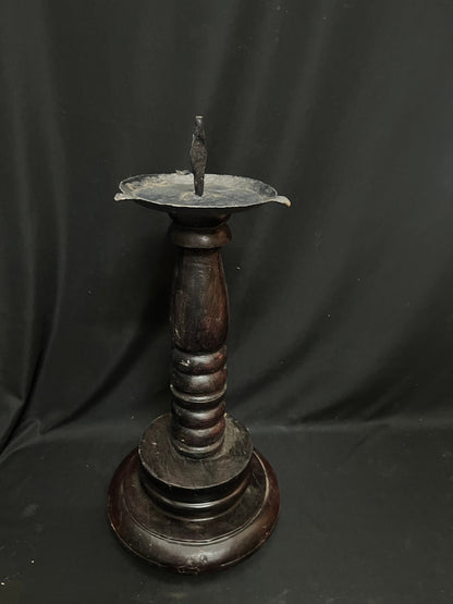 Vinatge wooden lamp with iron lamp on a wooden pillar