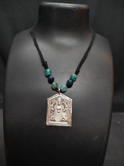 Silver embossed lakshmi pendant with black thread