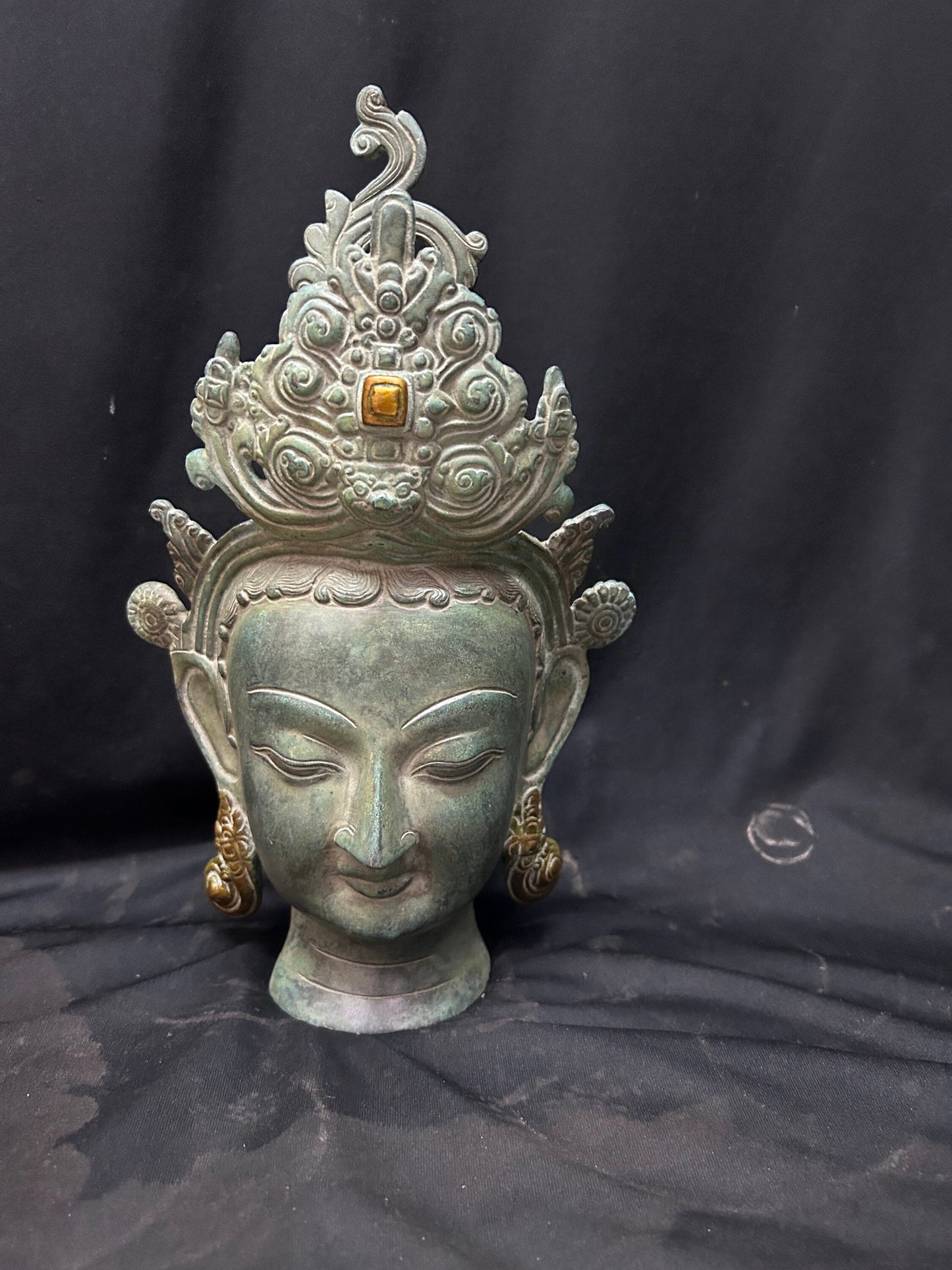 Brass cast Buddha mask with patina