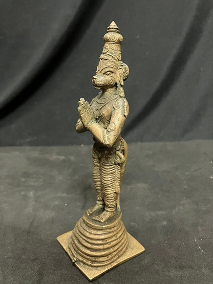 Indian antique store presents vintage idol of hanuman standing on the his tail