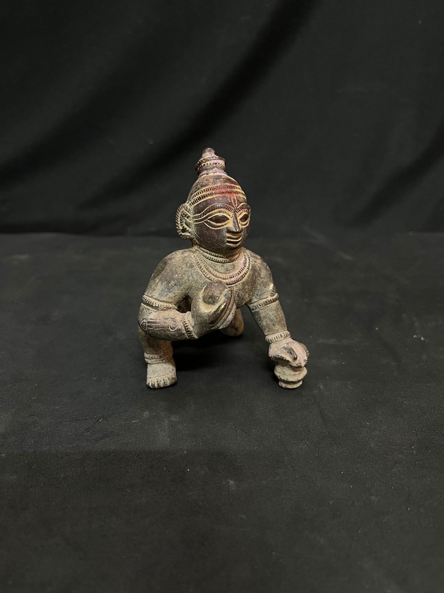 Indian antique store presents vintage idol of bala krishna from odisha