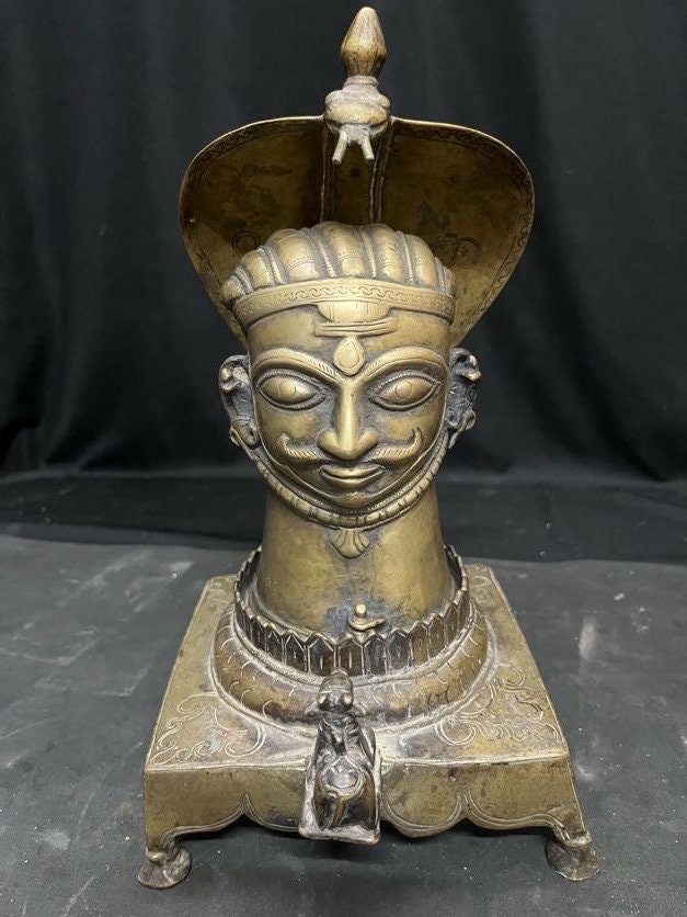 Vintage bronze cast Mukha lingam on a naag nandi peetam