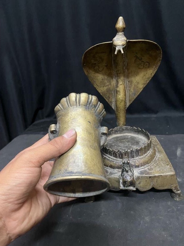 Vintage bronze cast Mukha lingam on a naag nandi peetam