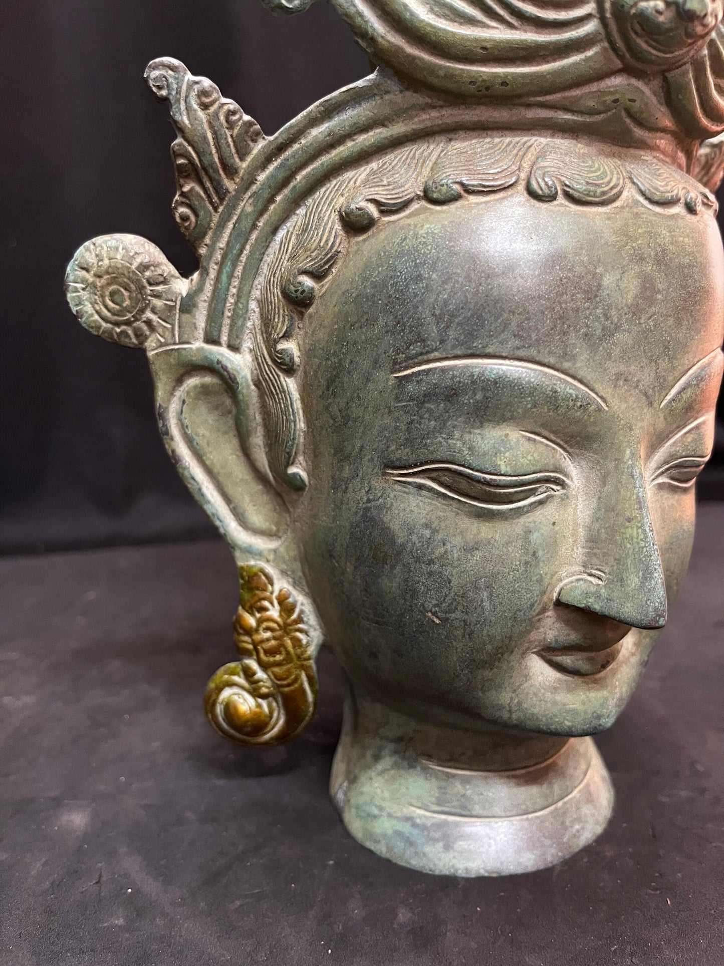 Brass cast Buddha mask with patina