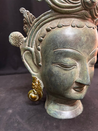 Brass cast Buddha mask with patina