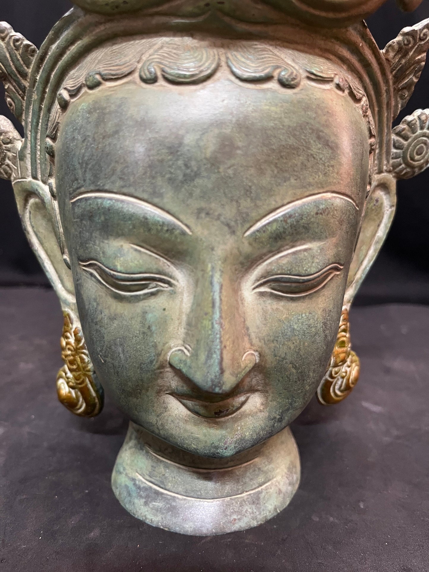 Brass cast Buddha mask with patina