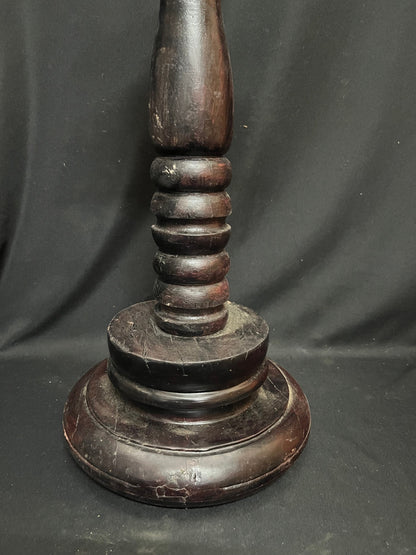 Vinatge wooden lamp with iron lamp on a wooden pillar