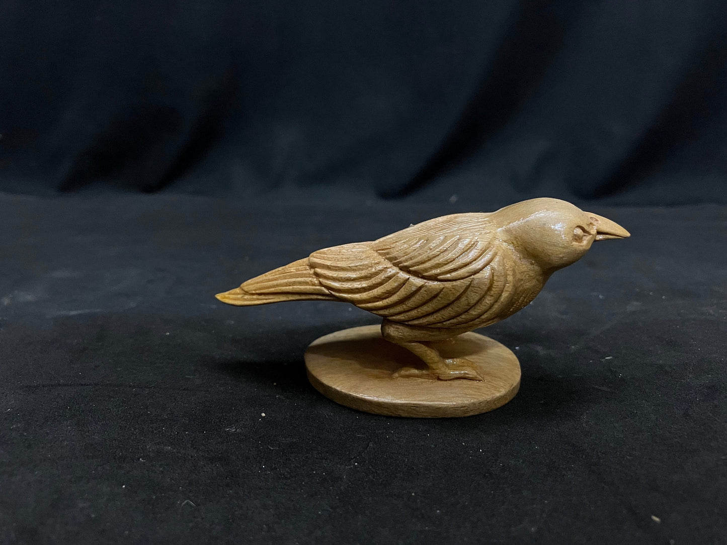 White teak made crow idol