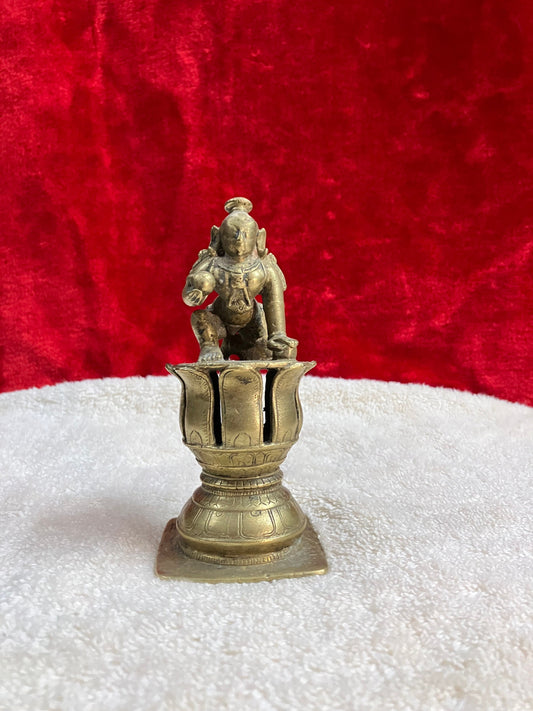 Vintage bronze krishna idol on a lotus pedestal