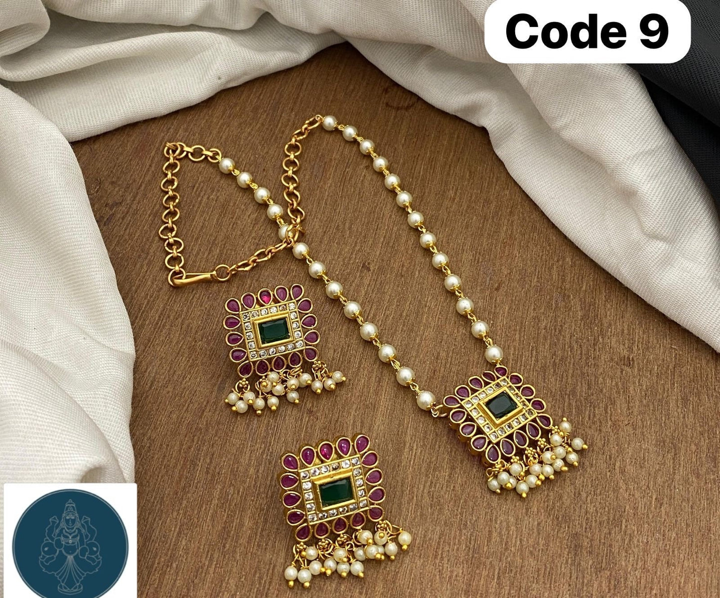 Panchaloha made gold polished gem stones and kundans studded pearl bearing pendant with pearl chain along with earrings