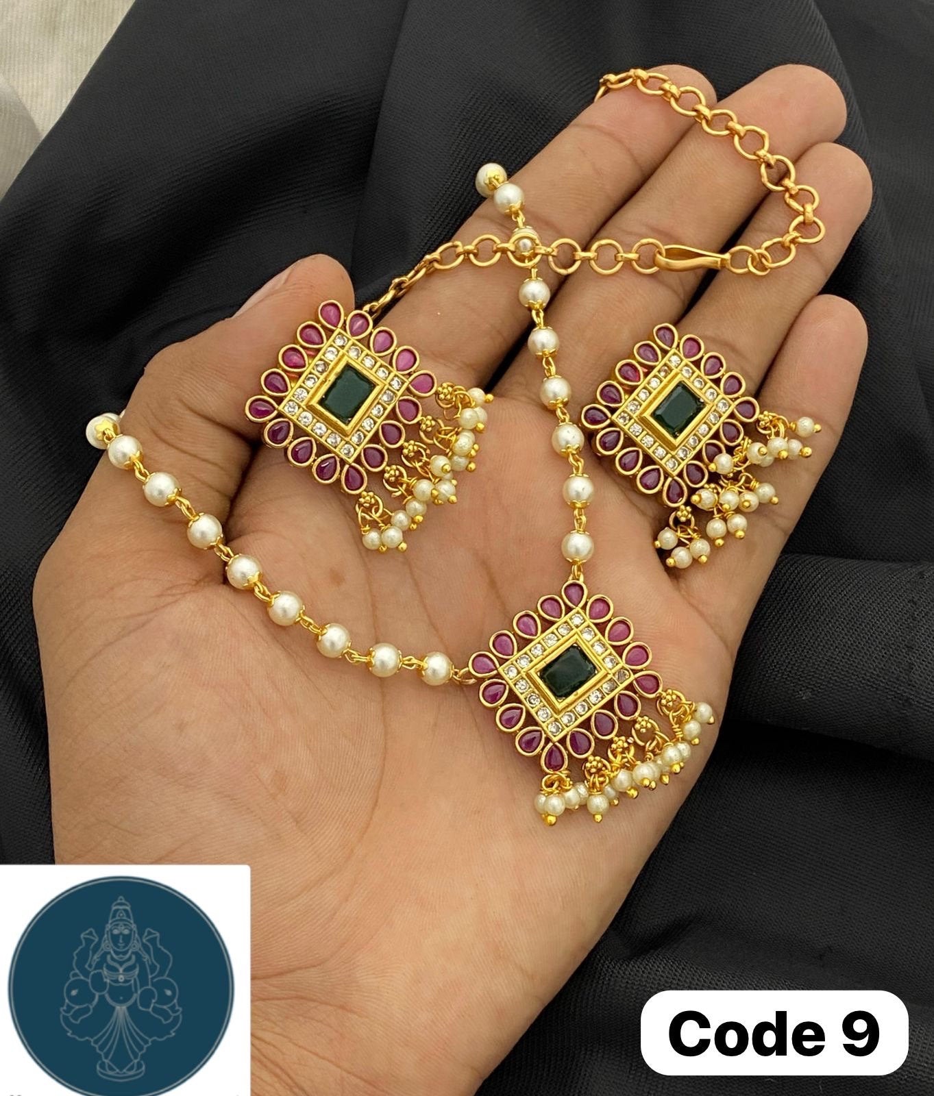 Panchaloha made gold polished gem stones and kundans studded pearl bearing pendant with pearl chain along with earrings