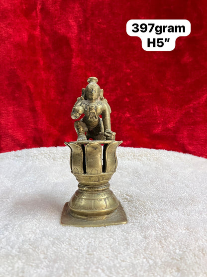 Vintage bronze krishna idol on a lotus pedestal