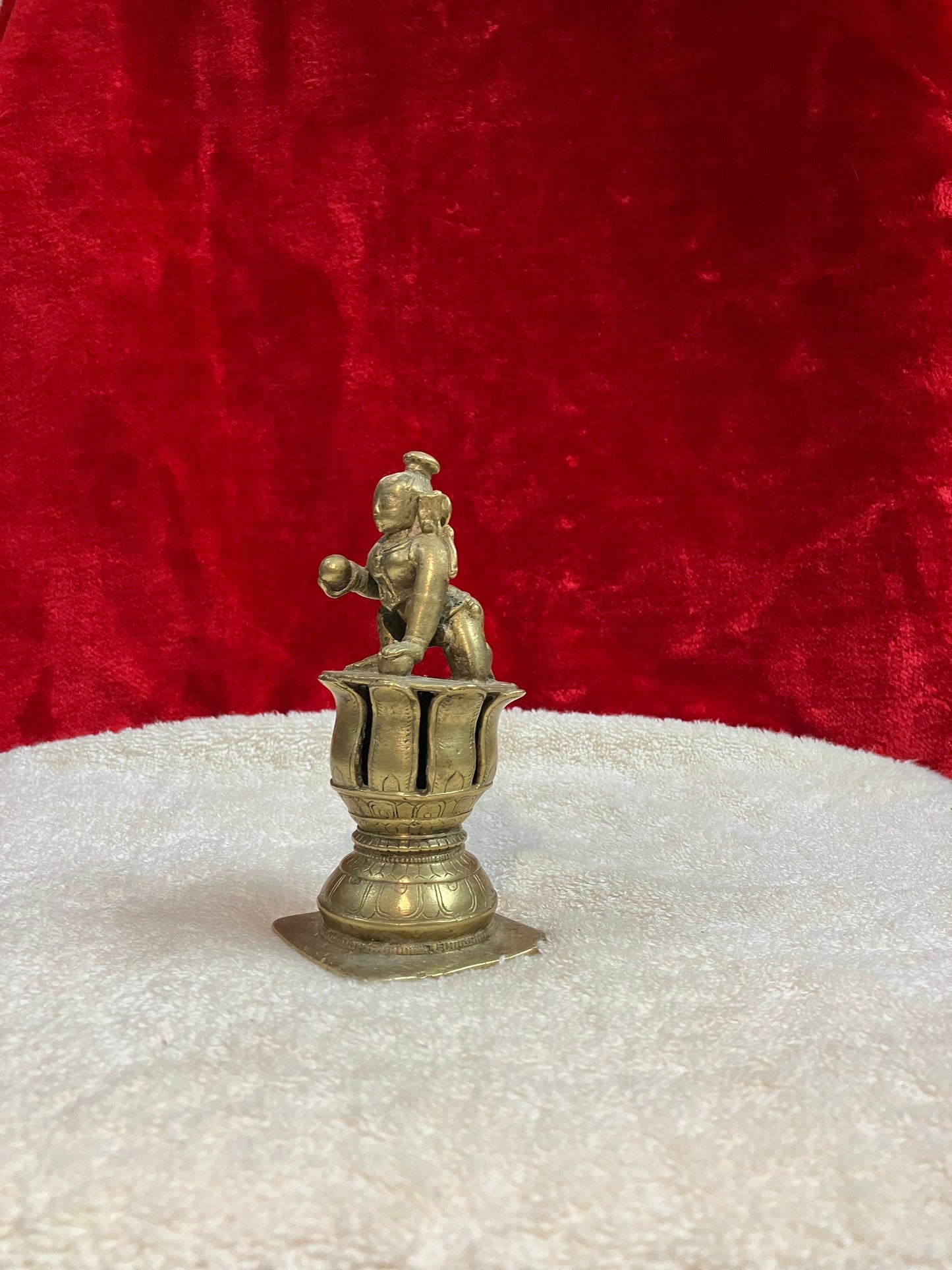 Vintage bronze krishna idol on a lotus pedestal