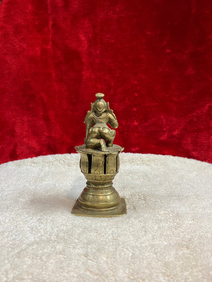 Vintage bronze krishna idol on a lotus pedestal