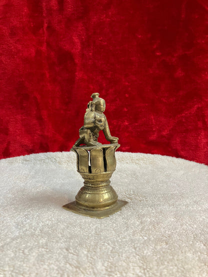 Vintage bronze krishna idol on a lotus pedestal