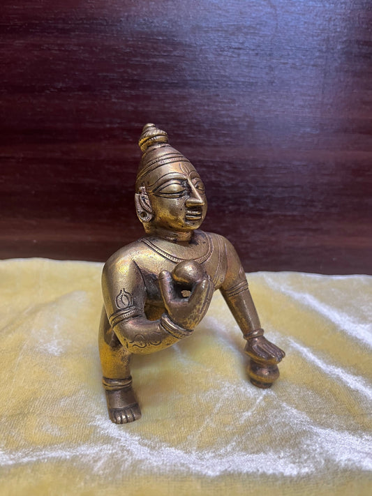 Vintage bronze idol of Crawling butter ball krishna