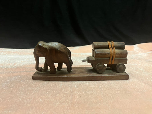 Vintage rosewood elephants carrying wooden log artefact