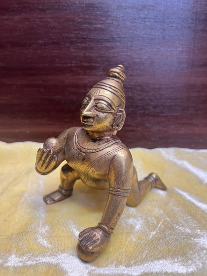 Vintage bronze idol of Crawling butter ball krishna