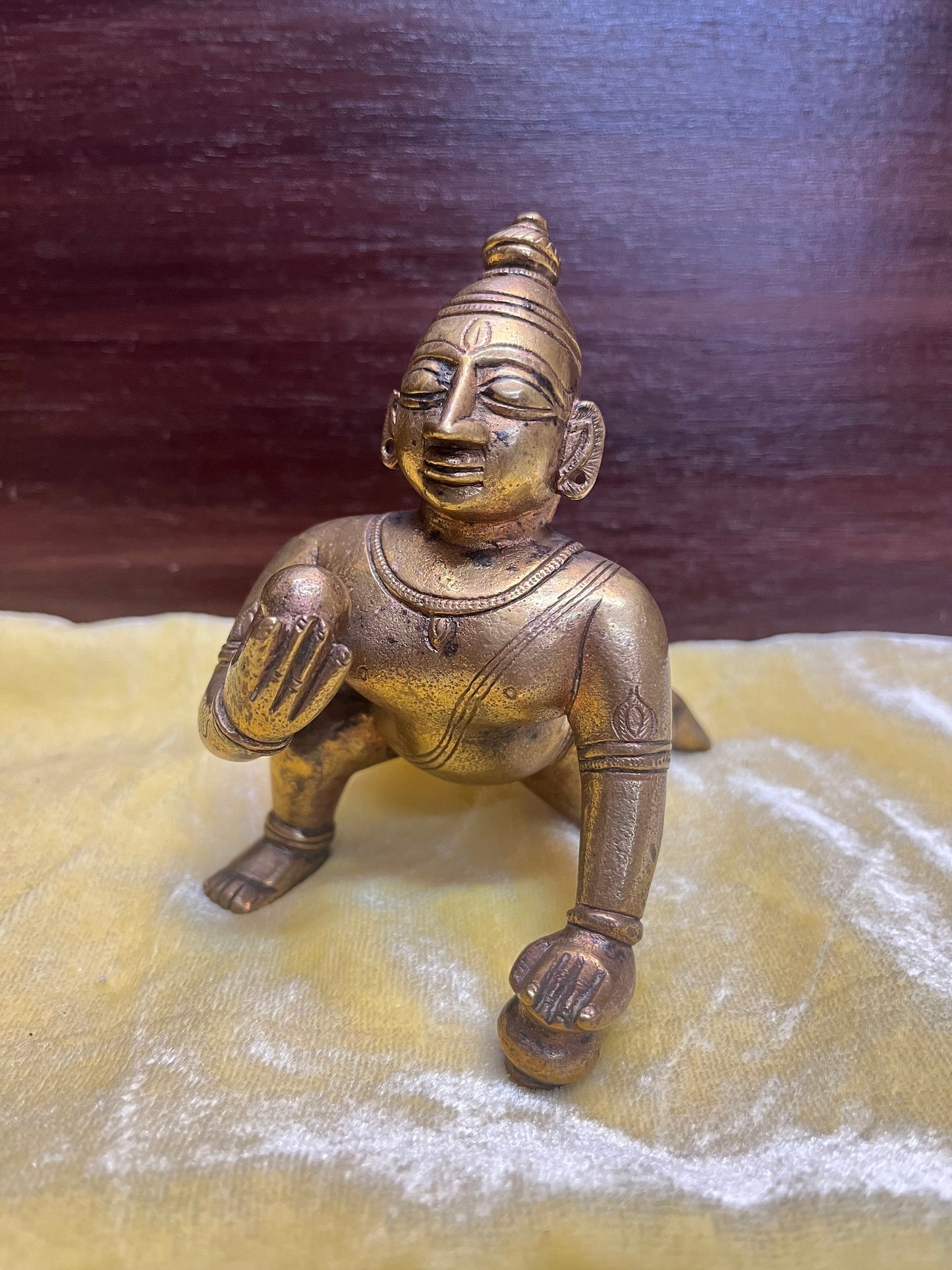 Vintage bronze idol of Crawling butter ball krishna