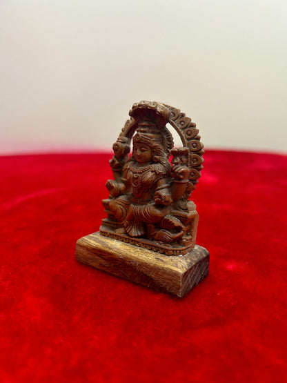 Sandalwood made padmavati idol , jain god