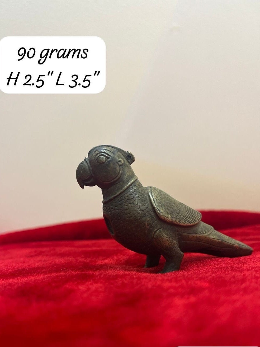 Vintage bronze made figurine of bird ( top hole is evident ) due to age